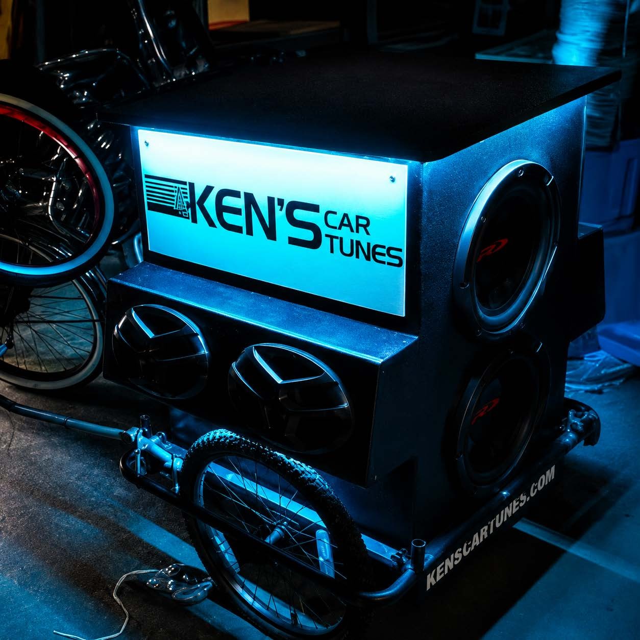 Ken's Car Tunes branded display box with blue LED